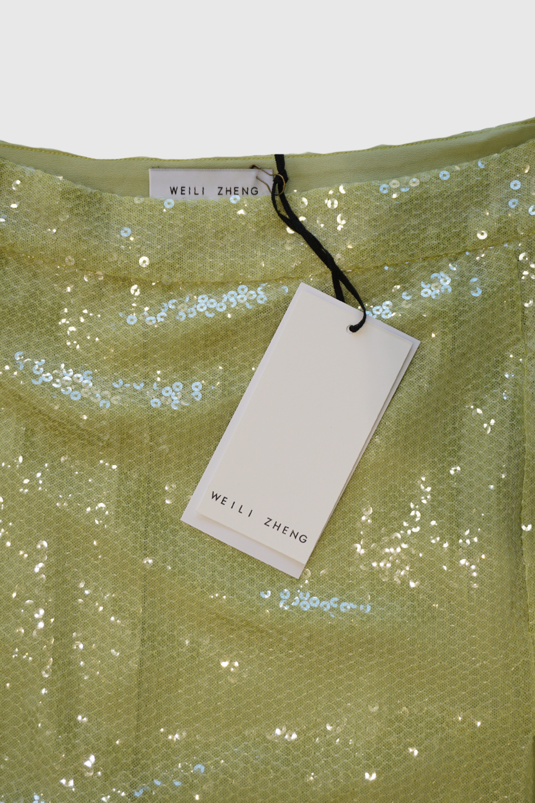 Longuette verde in paillettes con spacco